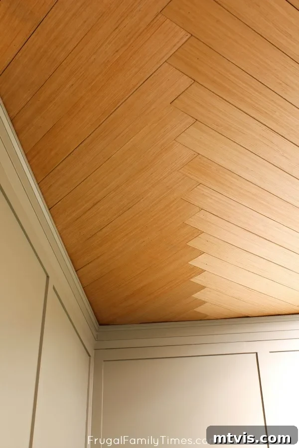 The Fifth Wall: Stunning Ceiling Designs 18 diy herringbone plywood ceiling in basement, featuring an intricate pattern