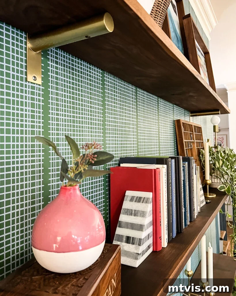 Stylish DIY wall shelves against a beautifully wallpapered wall, featuring curated decorative items.
