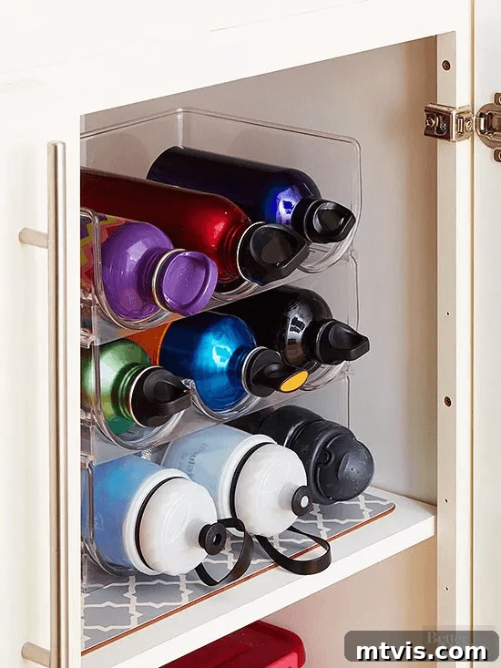 Wine rack repurposed for water bottle storage in a cabinet