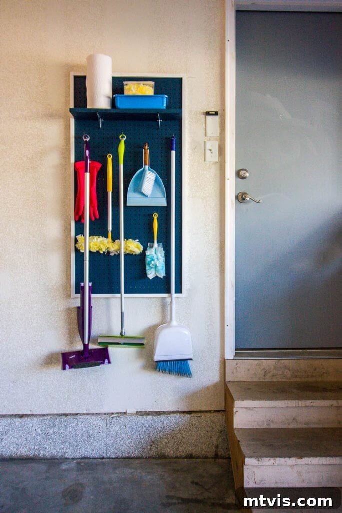 DIY pegboard organizer for cleaning tools in a neat utility area