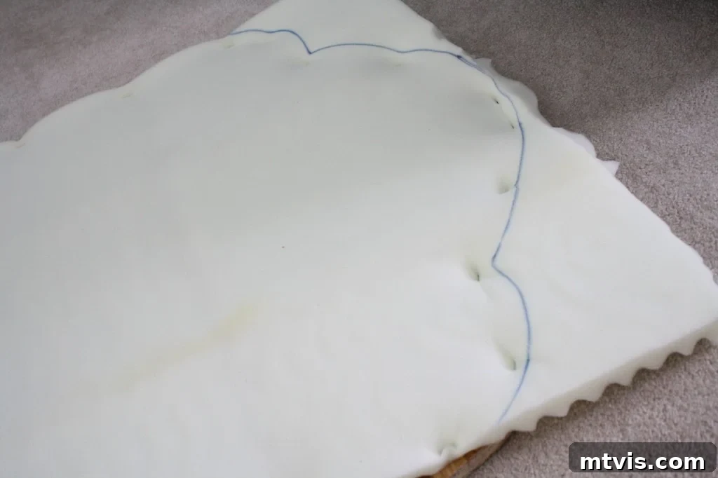 Custom Upholstered Headboard Project 7 Securing the doubled egg crate foam onto the headboard base for a plush and comfortable surface.