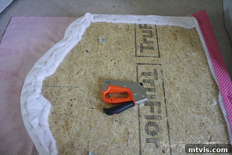 Custom Upholstered Headboard Project 13 Detail shot of the new fabric being stapled, showing the smooth finish.