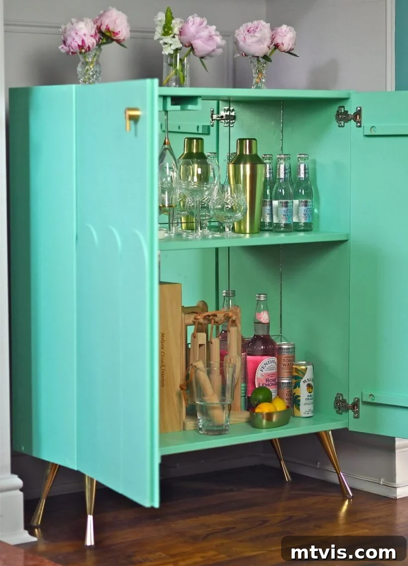 Small IKEA hack bar cabinet with mirror tiles and glam details
