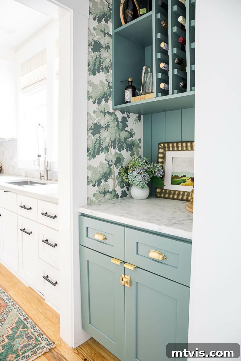 Coat closet transformed into a vibrant dry bar with wallpaper and shelving