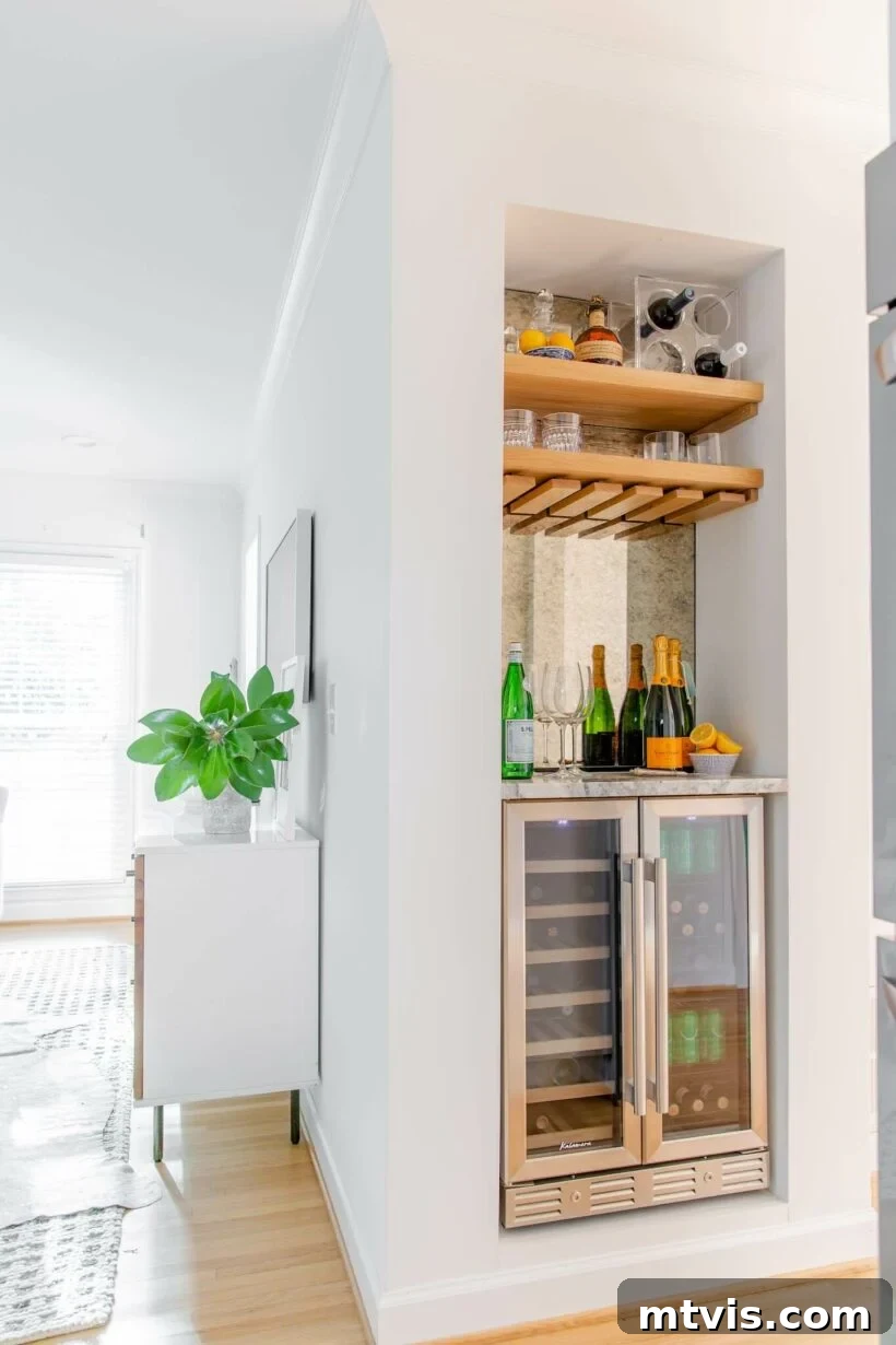 Skinny built-in bar maximizing a small nook with a drink fridge