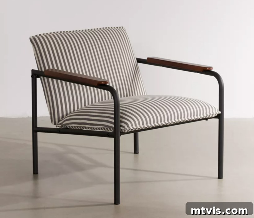 Score Stylish Accent Chairs on a Budget 12 A sophisticated striped accent chair from Urban Outfitters with wood armrests and a dark metal frame.