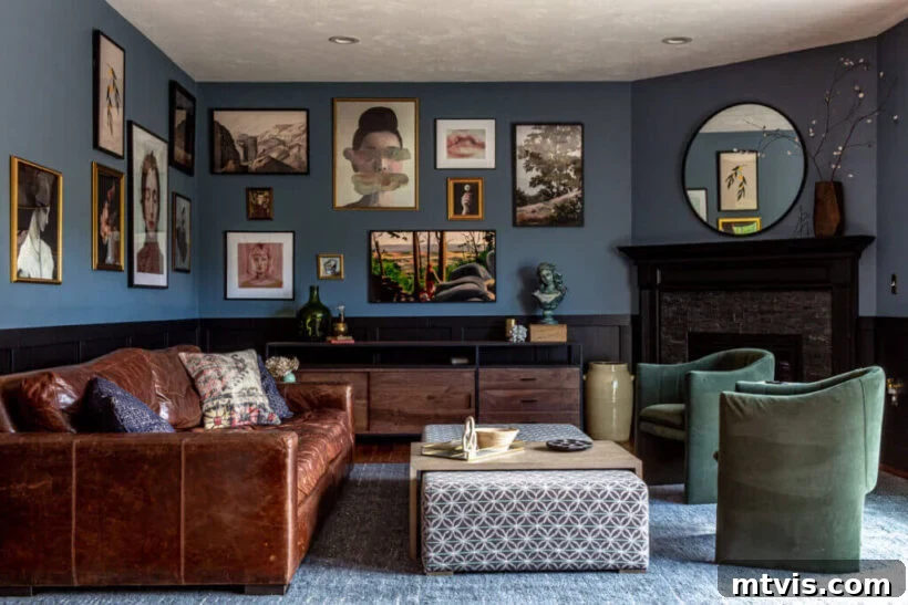 Sophisticated Serenity: Top Blue-Gray Paint Colors 4 A moody living room with a blue gray paint color on the wall with gallery art and a leather couch.