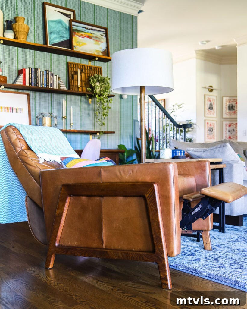 West Elm Spencer Recliner: The 5-Year Verdict 4 Detailed shot of the leather West Elm Spencer recliner, highlighting its texture and elegant form in a well-appointed family room.