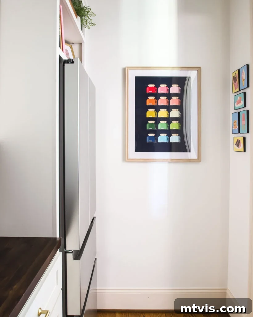Butler's pantry corner featuring personalized artwork on a narrow wall space.