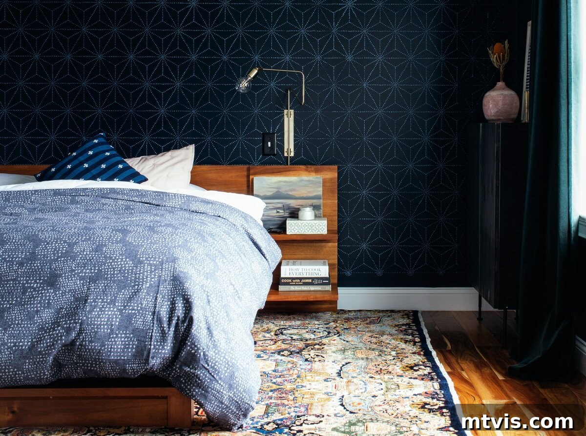 Designer-Approved Navy Blue Hues 3 Polo Blue bedroom walls with a geometric print behind a bed with a light blue bedspread.