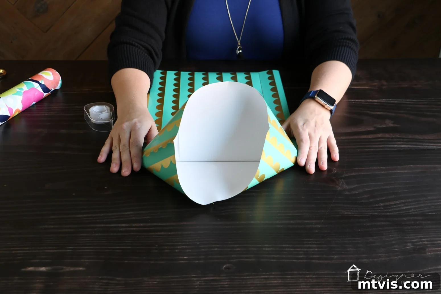 Upcycle Wrapping Paper into Custom Gift Bags 5 Separating and flattening corners to form the diamond base of a DIY gift bag