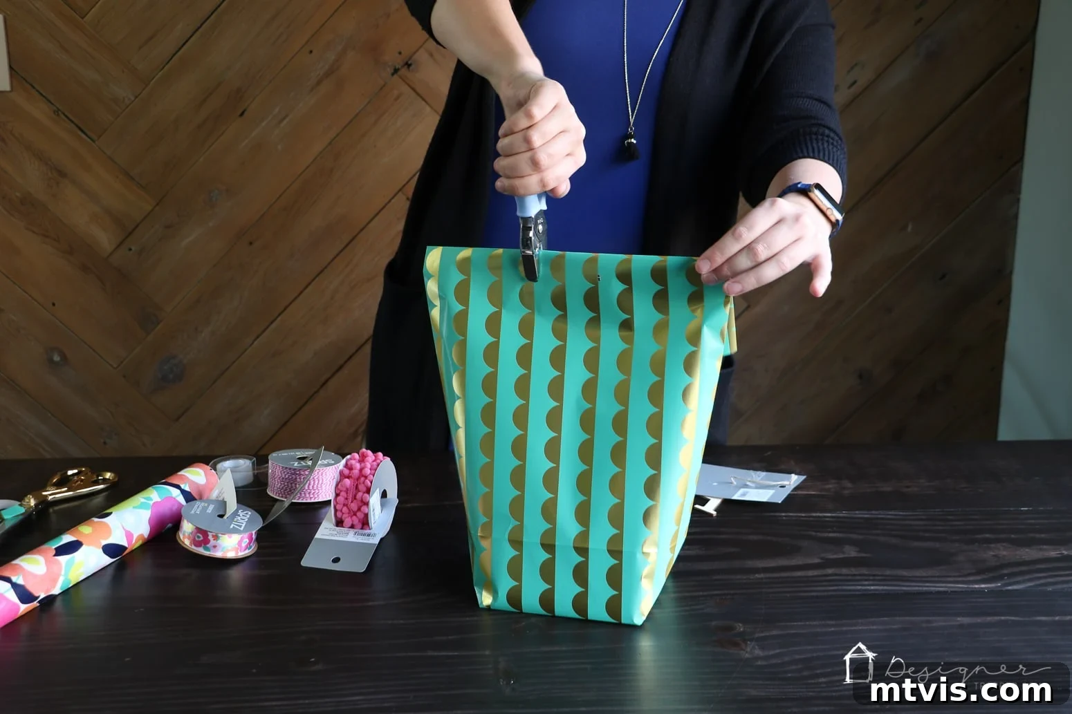 Upcycle Wrapping Paper into Custom Gift Bags 9 Close-up of hole-punched top of a DIY gift bag