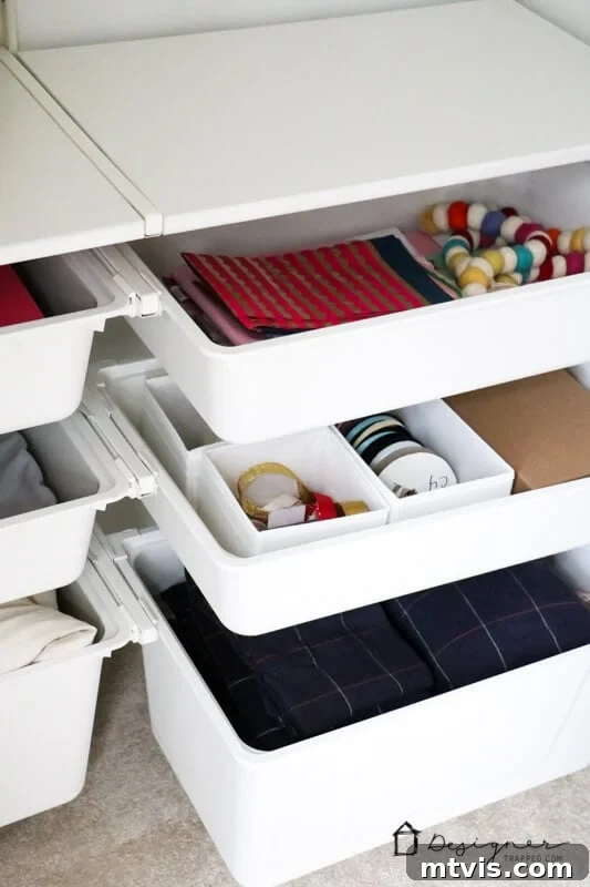 Transform Your Closets: 7 DIY Makeovers and Our Go-To Systems 13 A close-up of IKEA drawer bins installed in a bedroom closet and filled with accessories and clothes.