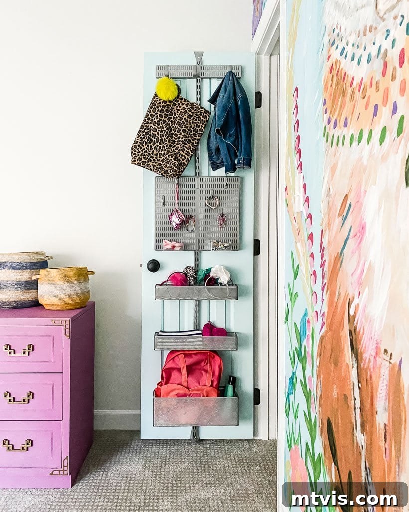 Transform Your Closets: 7 DIY Makeovers and Our Go-To Systems 6 A bedroom closet door has back-of-the-door storage from the Elfa system. Bows, bags and accessories are organized on the slim door, next to a large wall mural and a lavender dresser.