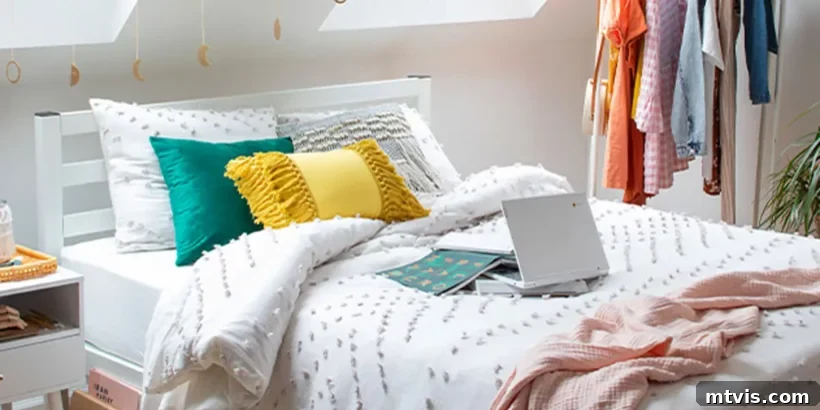 Ultimate Dorm Room Style Ideas and Shopping Sources 3 An Amazon-inspired dorm room setup showcasing a neatly made twin bed with a cozy, textured bedspread. Adjacent to the bed, a practical clothes rack holds hanging shirts, offering a clever storage solution for limited dorm room space. The decor emphasizes functionality and comfort.