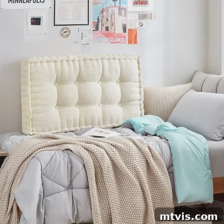 Ultimate Dorm Room Style Ideas and Shopping Sources 8 Wayfair's dorm room ideas include an inviting off-white tufted headboard on a dorm bed, complemented by cozy beige blankets. The space is personalized with thoughtful wall art and memorabilia, creating a warm and personalized student living environment.