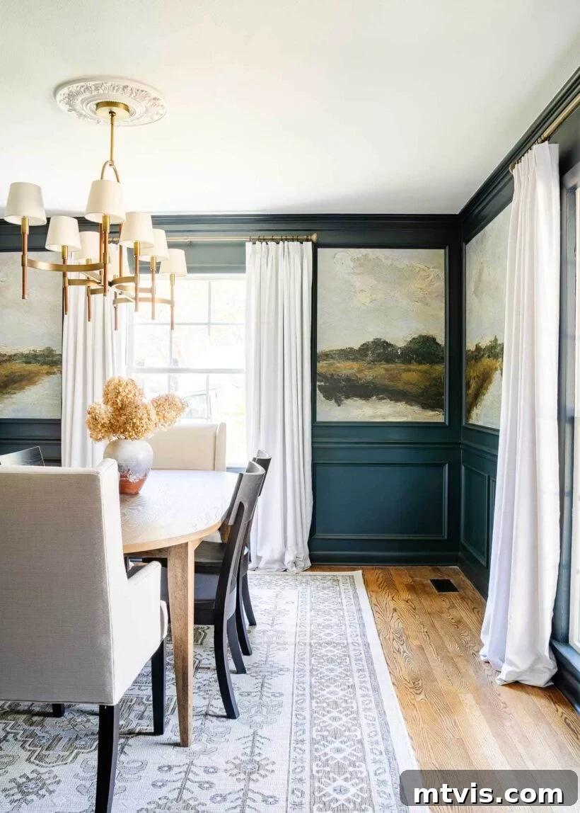 A sophisticated navy dining room adorned with vintage landscape wallpaper, creating a timeless and elegant atmosphere.