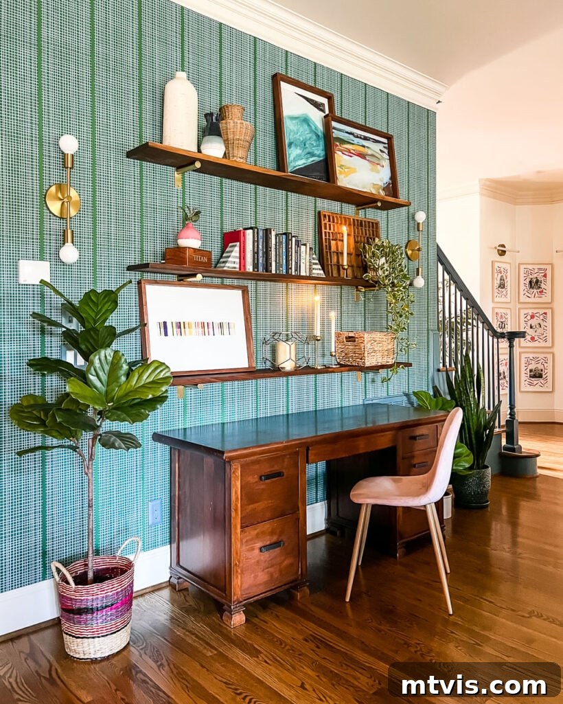 DIY wall shelves in a family room by Tasha Agruso of Kaleidoscope Living, demonstrating how to make wallpaper removable and renter-friendly.