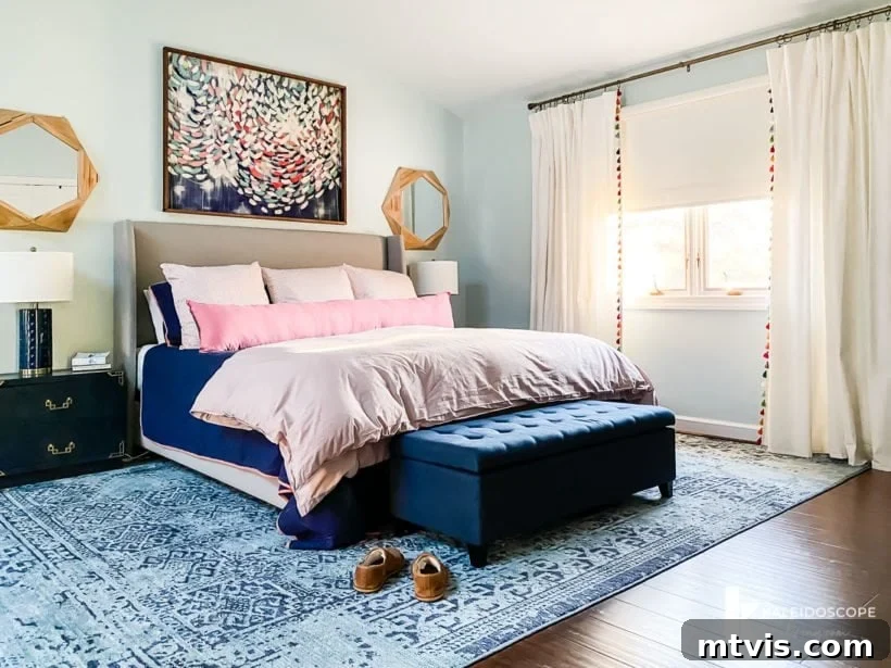Perfecting Your Bedroom: The Complete Rug Size and Placement Guide 7 An expansive 9' x 12' bedroom rug elegantly positioned under a king-size bed, with nightstands also resting on the rug.
