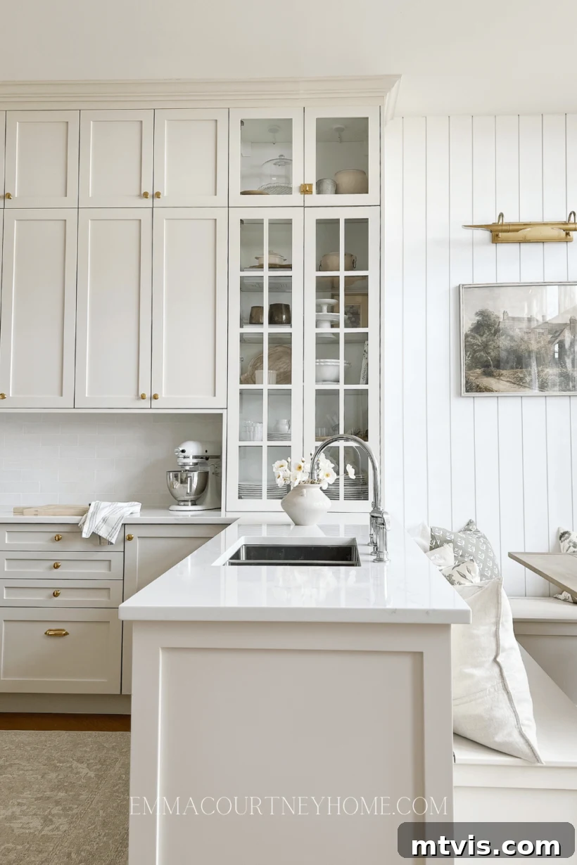 Elevate Your Kitchen with Timeless Neutral Cabinet Shades 11 Natural Cream by Benjamin Moore cabinets and white walls in kitchen