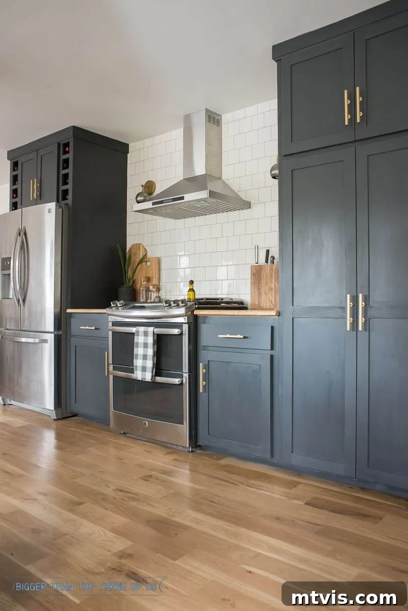 Elevate Your Kitchen with Timeless Neutral Cabinet Shades 14 Cracked Pepper by Behr on kitchen cabinets with white tile backsplash
