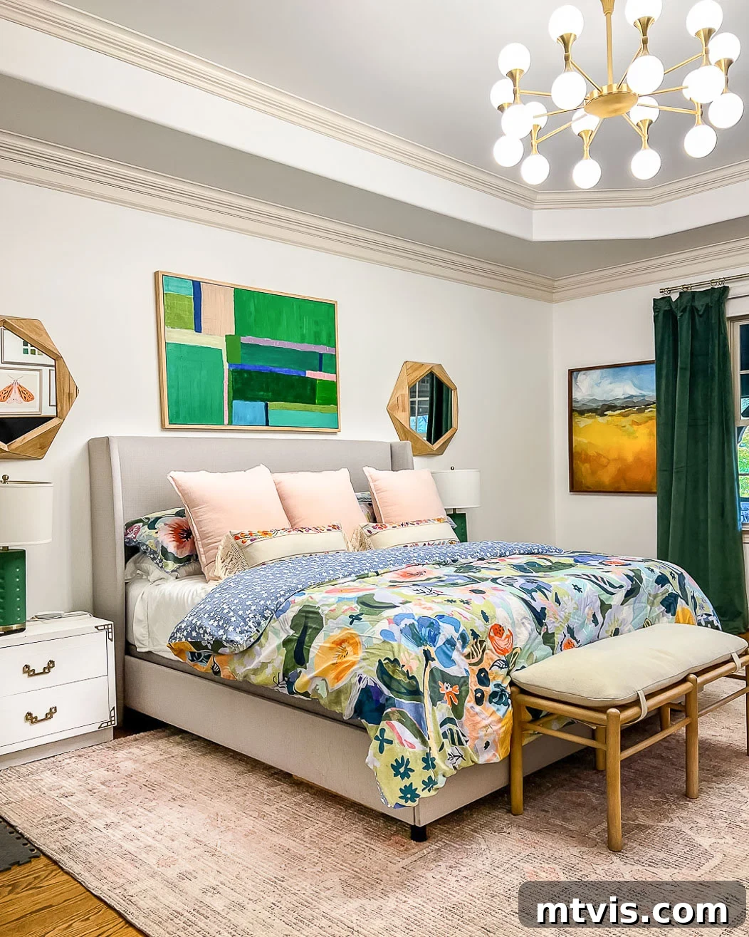 A 9 x 12 West Elm affordable area rug under a king size bed in a colorful and tidy bedroom, enhancing the cozy atmosphere.