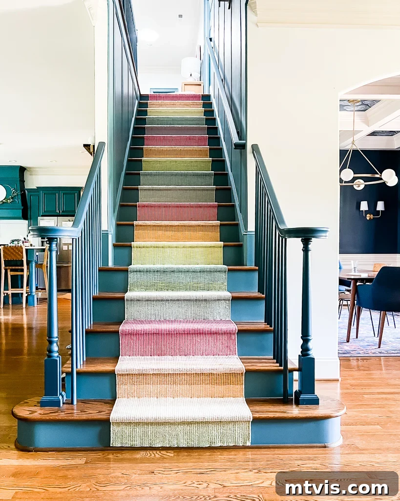 Blue and wood stairs are transformed into a focal point with the Annie Selke multicolor, bright staircase runner, installed DIY.