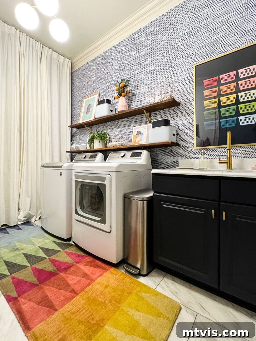 A brightly colored geometric affordable area rug adds vibrancy to a modern laundry room.