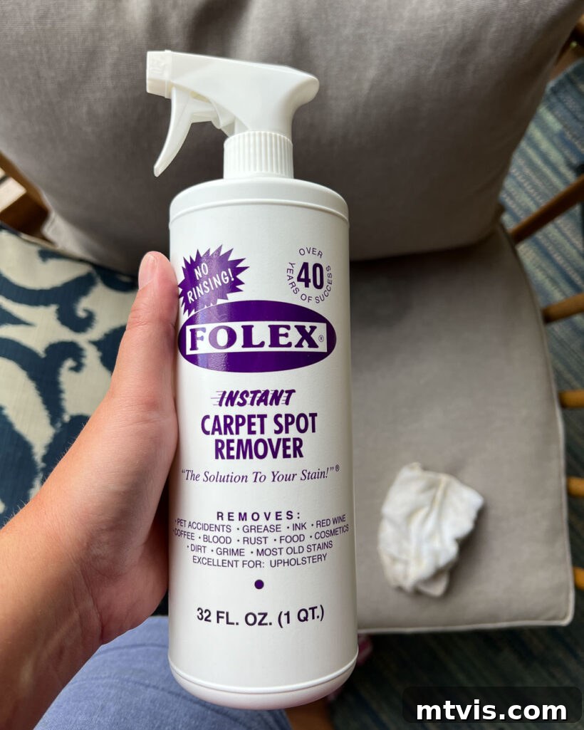 Unlock the Secrets to a Pristine Outdoor Rug 4 Woman holding Folex carpet cleaner bottle for spot treatment