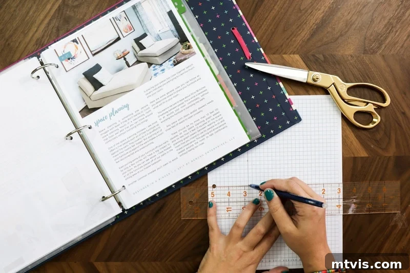 Space Planning Essentials: Design Your Perfect Layout 3 A person meticulously drawing out a space plan on graph paper, illustrating the detailed approach to furniture layout and placement.