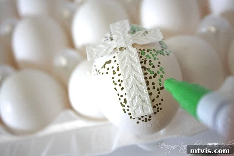 Detailed step-by-step image showing the process of applying dots with a Sharpie paint pen around a craft sticker placed on an Easter egg, demonstrating the gradient technique.