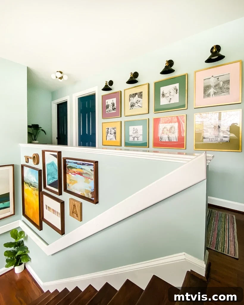 15 Stylish Stair Railing Concepts to Elevate Your Home 13 A flat banister is painted white and runs up a light-blue art wall for a striking look.