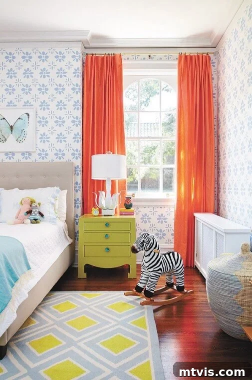 28 Whimsical Wonderland Bedrooms for Her 12 bedroom with periwinkle block print flowered wallpaper, bright orange curtains and pops of teal and chartreuse