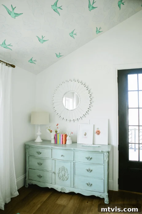 28 Whimsical Wonderland Bedrooms for Her 14 farmhouse girls' bedroom with bird wallpaper on ceiling