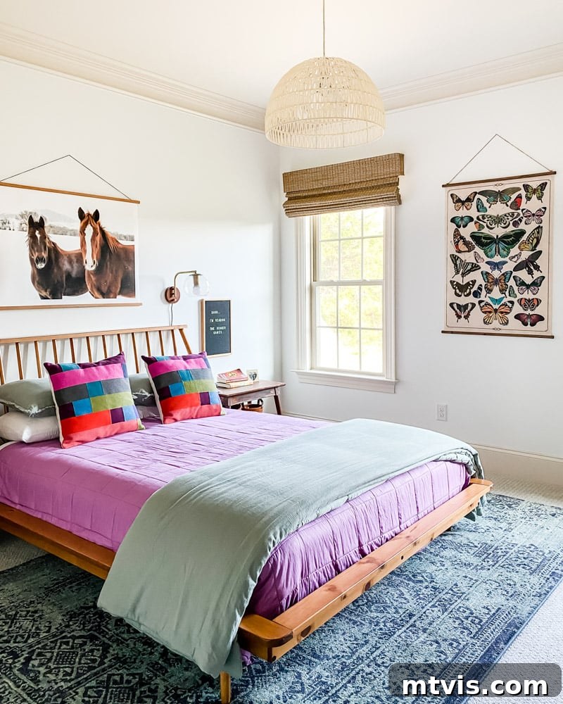 28 Whimsical Wonderland Bedrooms for Her 19 girls bedroom with mid century low wood bed with purple and sage bedding and naturalist prints on walls