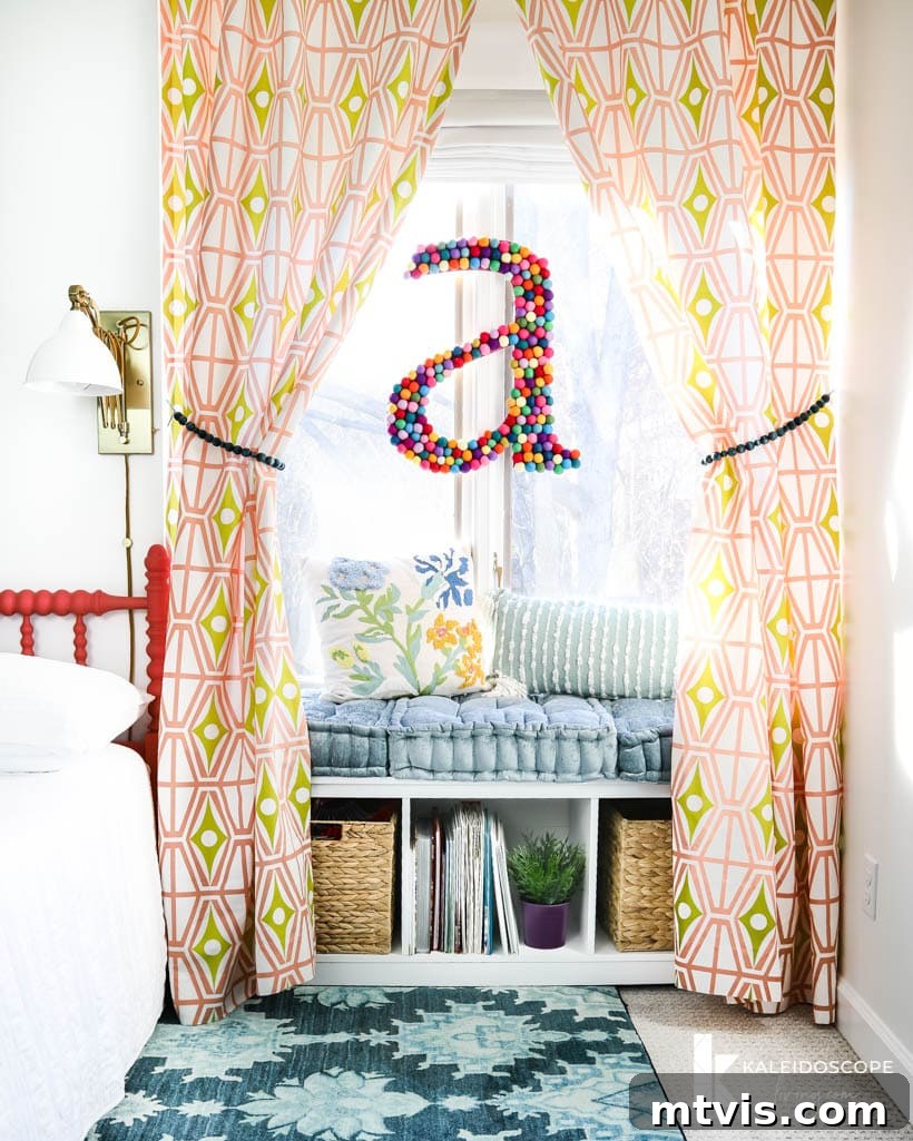 28 Whimsical Wonderland Bedrooms for Her 3 young girls reading bench with cushions and storage underneath, framed by geometric print curtains