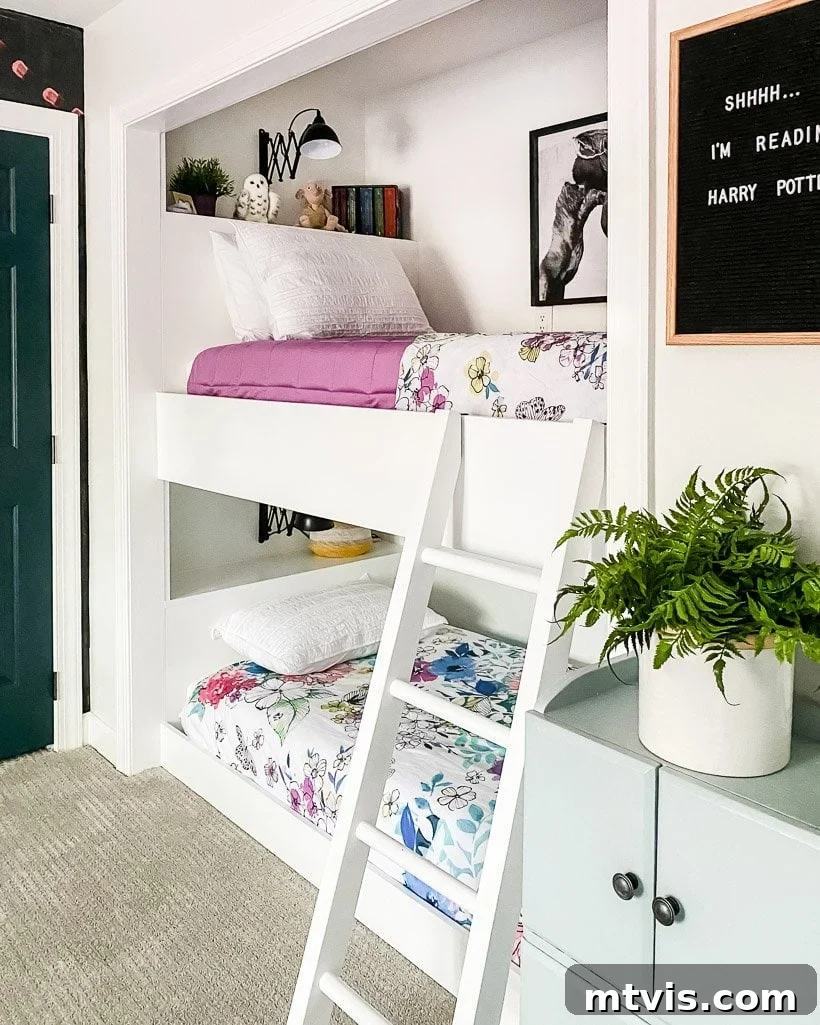 28 Whimsical Wonderland Bedrooms for Her 7 built-in bunk bed in girl's bedroom with floral bedspreads and shelves