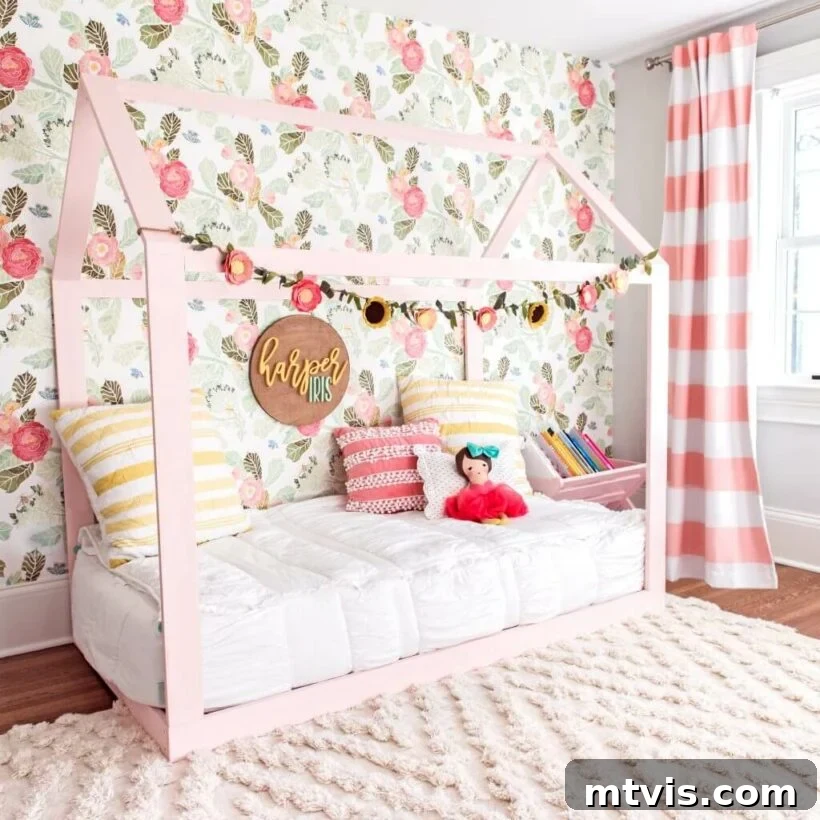 28 Whimsical Wonderland Bedrooms for Her 10 pink girl's bedroom with toodler house bed on floor and floral wallpaper