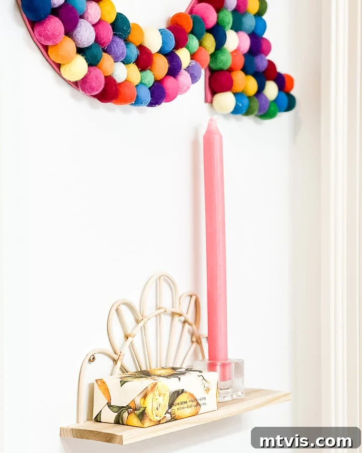 Supersize Your Walls With DIY Letters 12 Bathroom decor showing the colorful felt ball 'A' letter, reflecting in a mirror