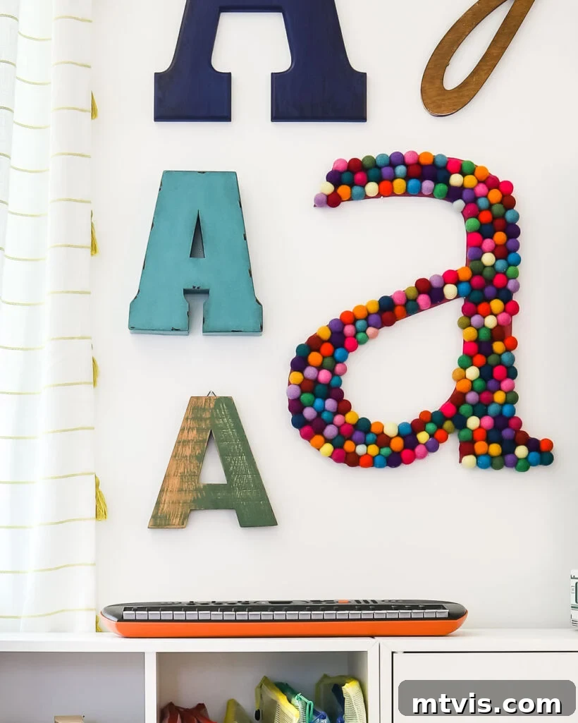 Supersize Your Walls With DIY Letters 15 Large DIY wall letter 'A' crafted with an assortment of colorful felt balls