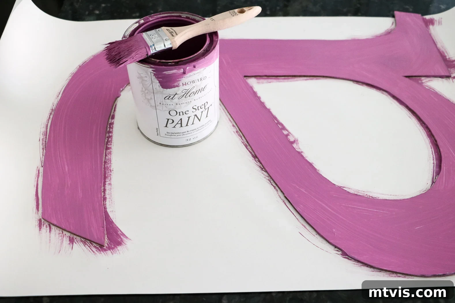 Large DIY wall letter base painted a soft purple hue
