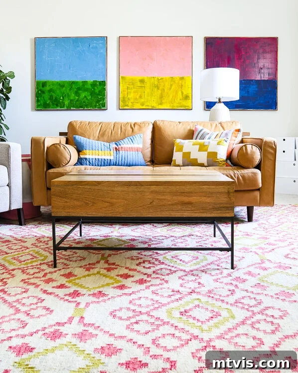 23 Ingenious DIY Wall Art Projects 12 A stylish and colorful family bonus room featuring a comfortable tan leather couch, complemented by vibrant abstract art pieces hanging elegantly above it.