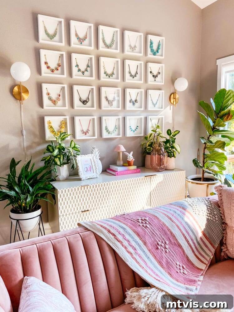 23 Ingenious DIY Wall Art Projects 20 A beautifully curated collection of fancy necklaces elegantly displayed within matching white shadow boxes, hung in a neat grid pattern on a wall.