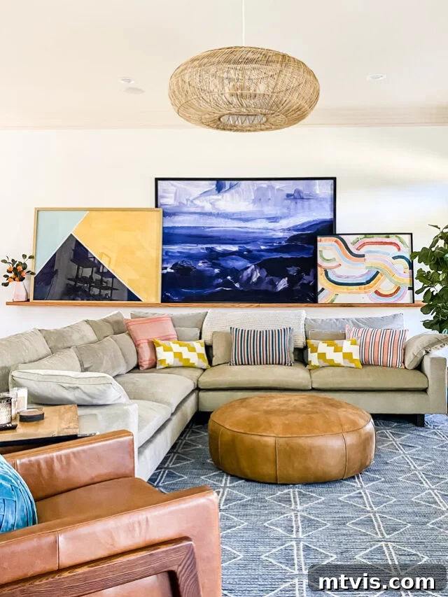 23 Ingenious DIY Wall Art Projects 3 A cozy family room featuring a beige couch and a striking large wall art display leaning on a DIY art ledge.