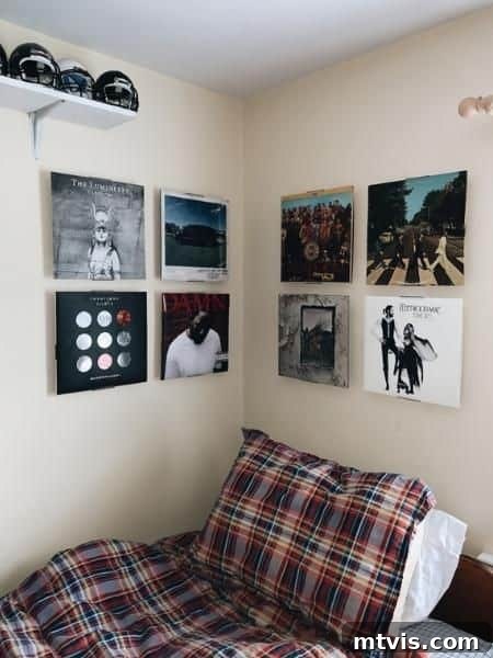 dorm with framed album covers as art, a creative way to decorate walls