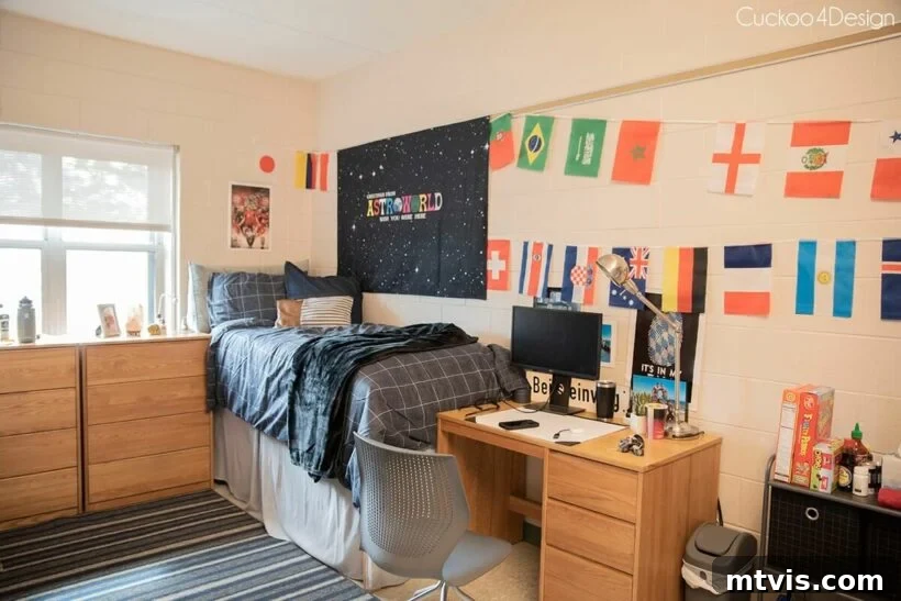 boys dorm room with international flags and gray bedding, featuring a comfortable desk chair