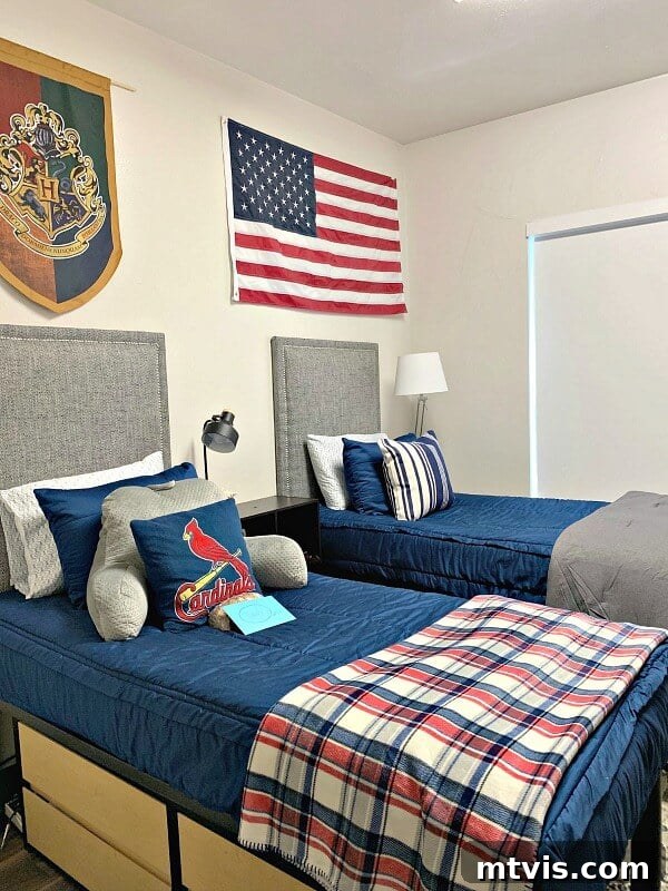 boy dorm room with gray headboards and blue bedding, a stylish and comfortable setup