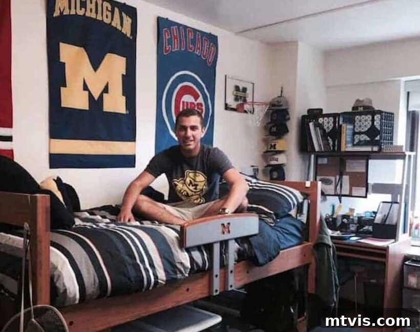 boy on dorm room bed with flags hanging behind him, showcasing personal interests