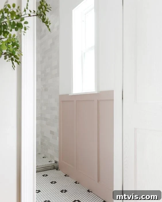 15+ Ingenious DIY Bathroom Renovation Ideas That Won't Break the Bank 11 pink board and batten wall in a stylish black and white bathroom, adding character