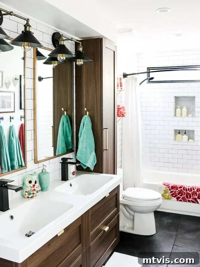 15+ Ingenious DIY Bathroom Renovation Ideas That Won't Break the Bank 17 updated bathroom shared by young girls, featuring new natural stone flooring and a fresh design
